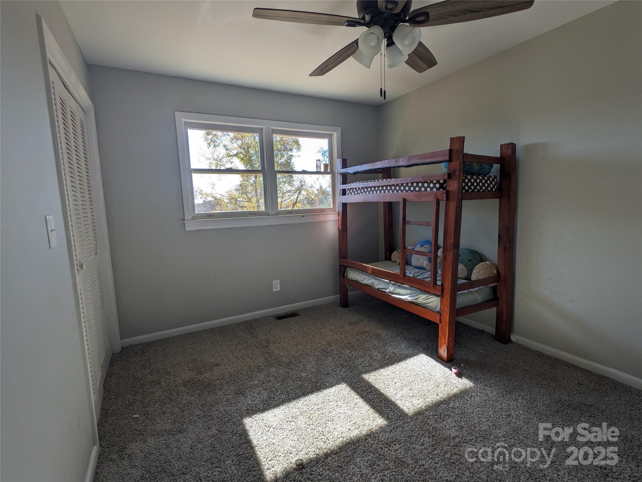 1737 Whiteside Road Forest City, NC 28043 - Photo 11 of 18 a bedroom with bunk bed and a window