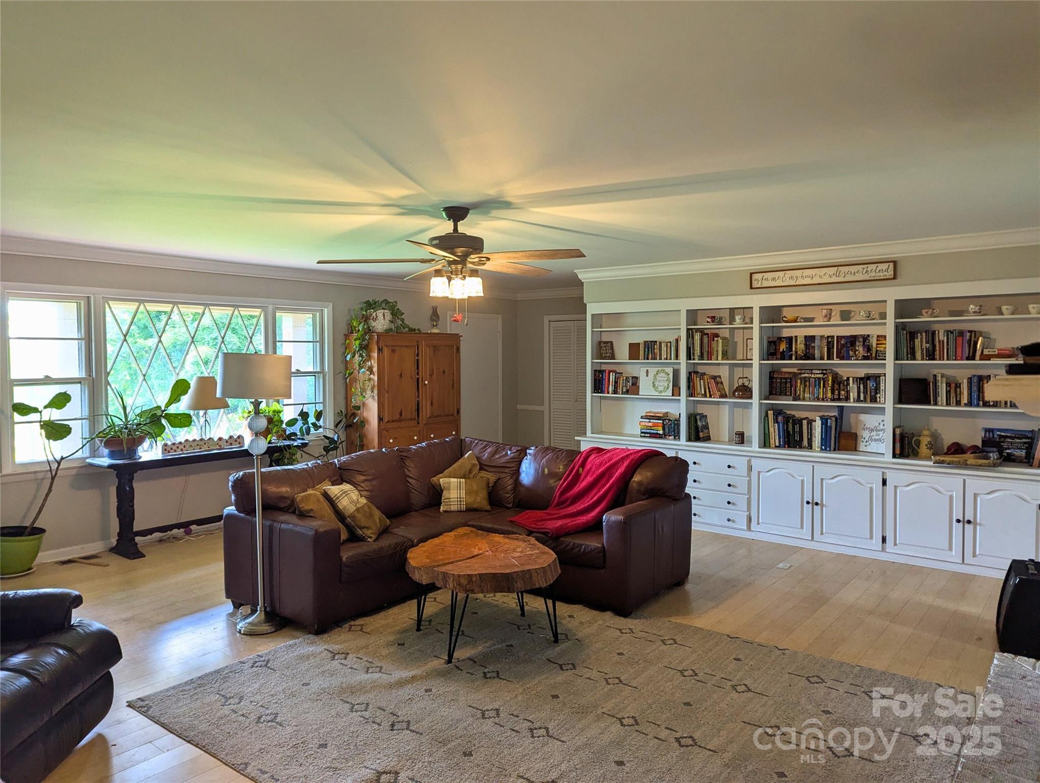 1737 Whiteside Road Forest City, NC 28043 - Photo 3 of 18 a living room with furniture hard wood floor and a floor to ceiling window