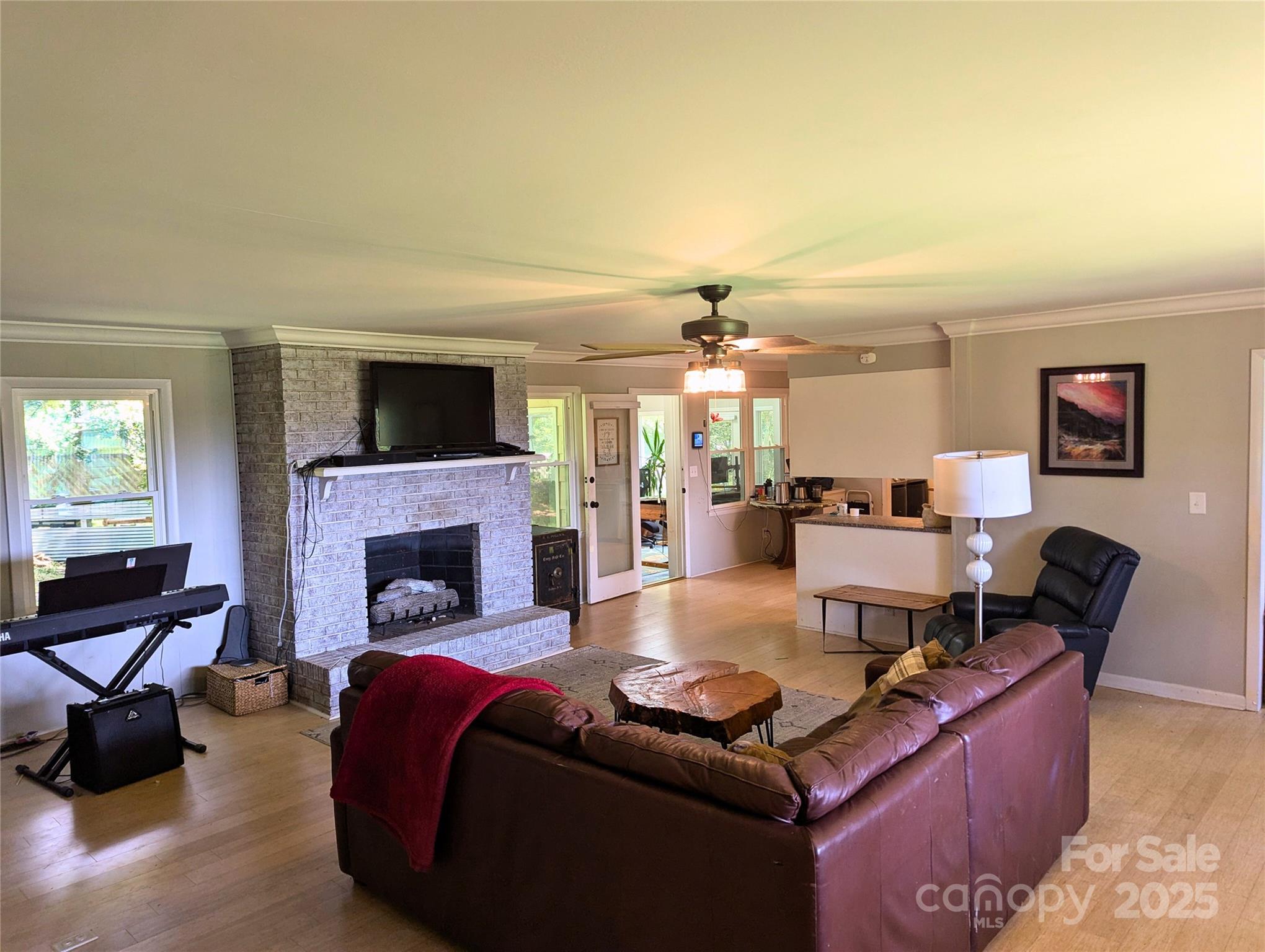 1737 Whiteside Road Forest City, NC 28043 - Photo 4 of 18 a living room with furniture and a fireplace