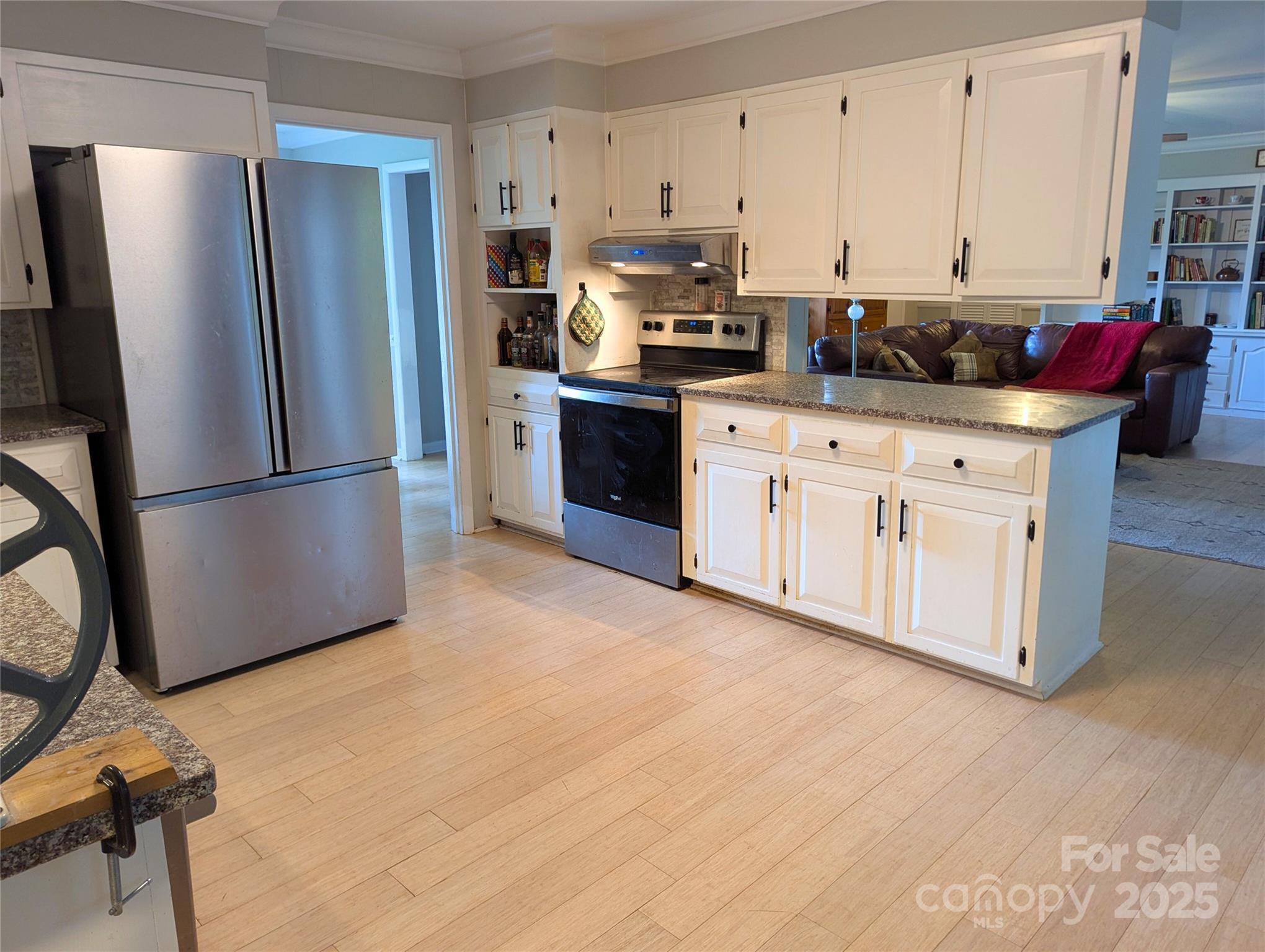 1737 Whiteside Road Forest City, NC 28043 - Photo 6 of 18 a kitchen with stainless steel appliances a refrigerator sink and cabinets