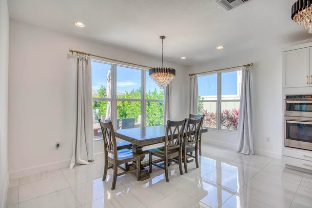 a living room with furniture a rug and a window