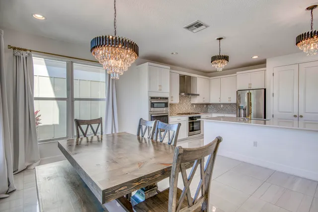 a view of a big room with windows and cabinet