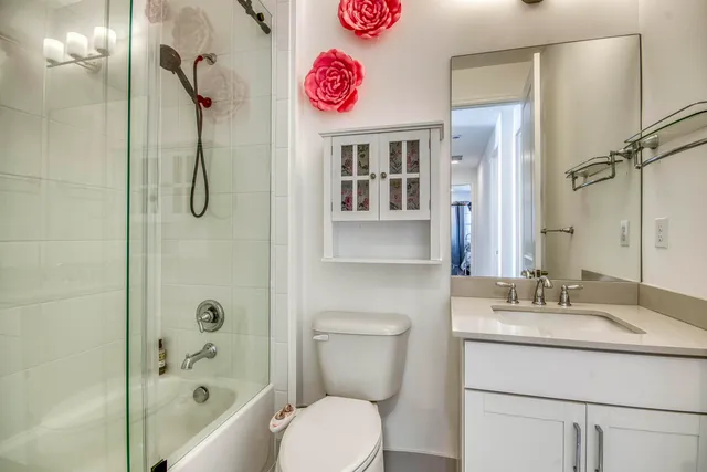 an aerial view of a house with a swimming pool yard and lake view in back