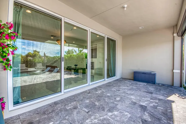 a aerial view of a house with a big yard and large trees