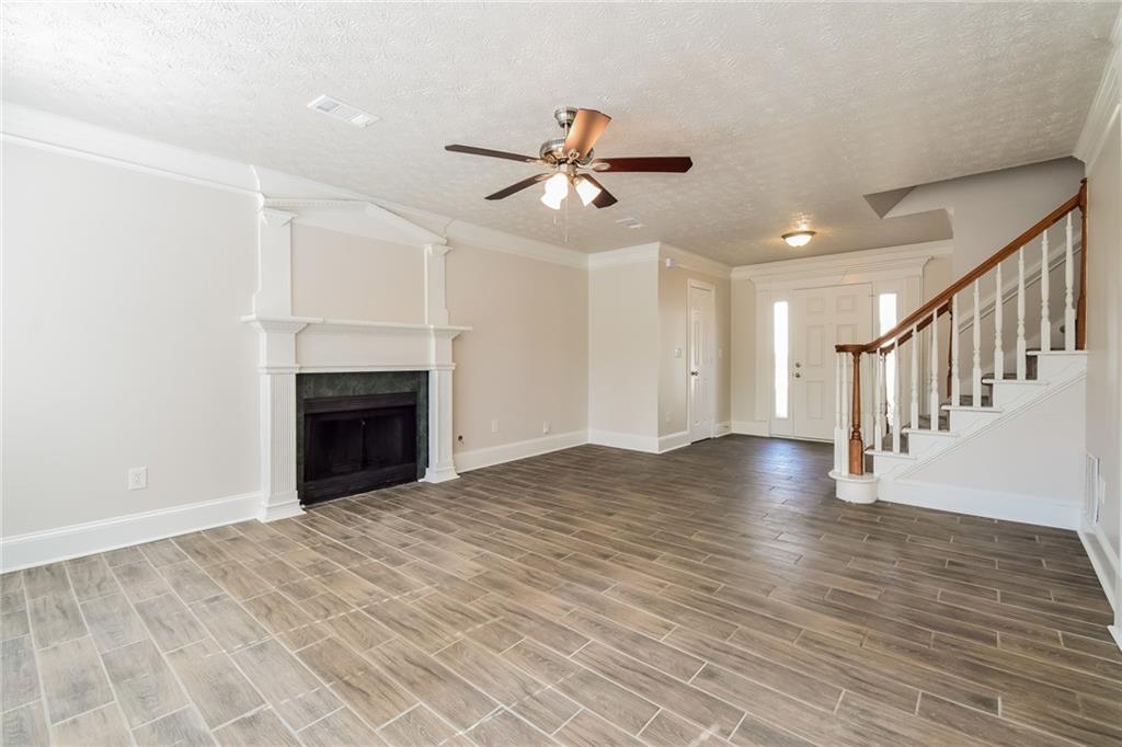 3543 Benthollow Way Duluth, GA 30096 - Photo 11 of 25 a view of empty room with wooden floor and fan