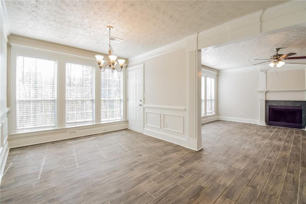 3543 Benthollow Way Duluth, GA 30096 - Photo 14 of 25 a view of an empty room with a window and a kitchen