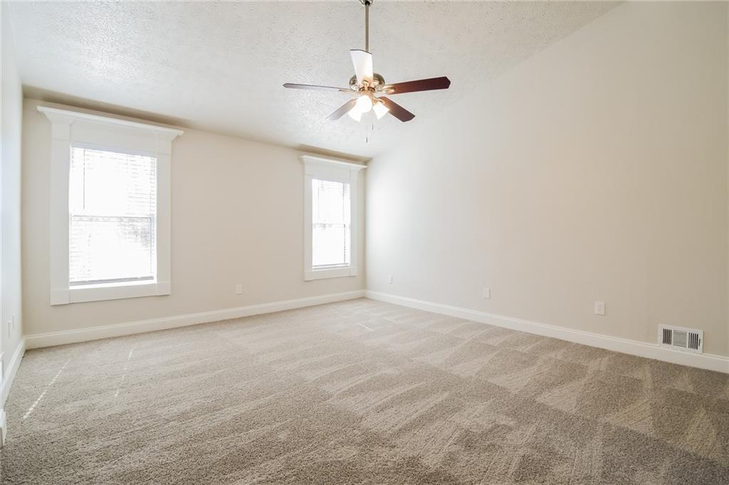 3543 Benthollow Way Duluth, GA 30096 - Photo 19 of 25 an empty room with windows and fan