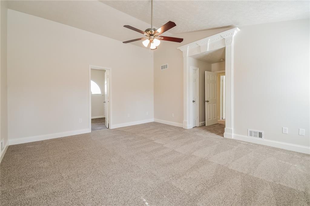 3543 Benthollow Way Duluth, GA 30096 - Photo 21 of 25 a view of an empty room with a ceiling fan