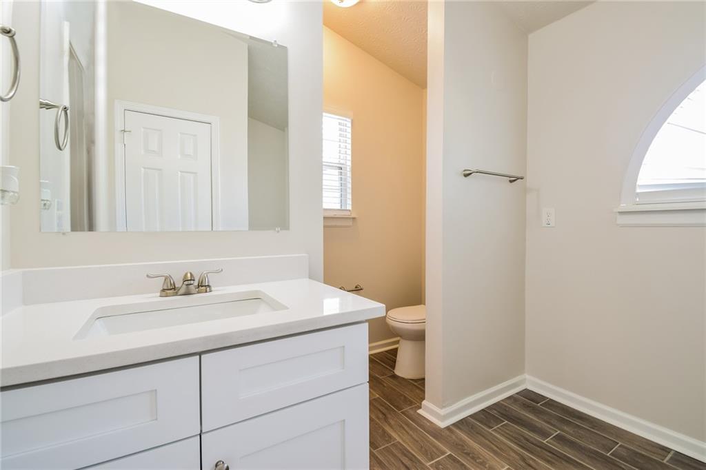 3543 Benthollow Way Duluth, GA 30096 - Photo 22 of 25 a bathroom with a sink and a mirror