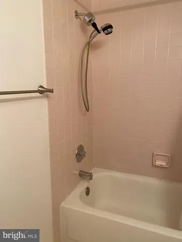 a bathroom with a shower and a bathtub