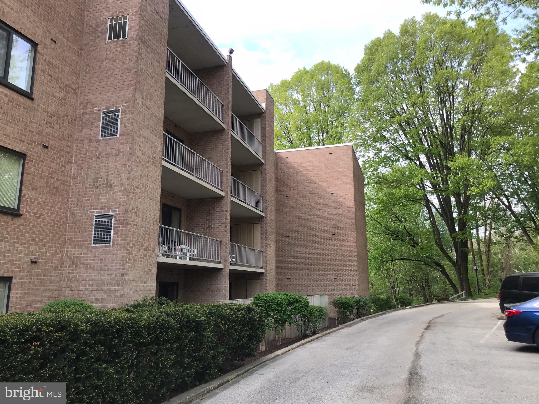 1637 Oakwood Drive, Unit S103 Narberth, PA 19072 - Photo 22 of 23 a front view of a house with a garden