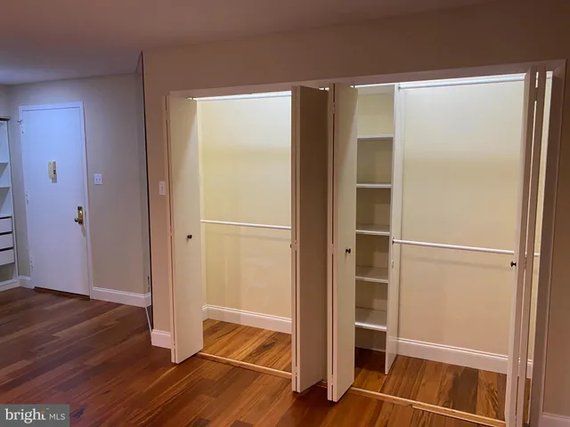 a area with wooden floor and closet