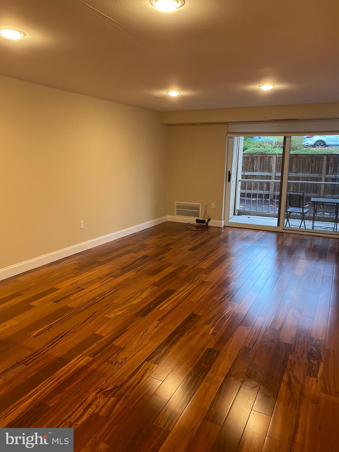 1637 Oakwood Drive, Unit S103 Narberth, PA 19072 - Photo 8 of 23 a view of an empty room with wooden floor and windows