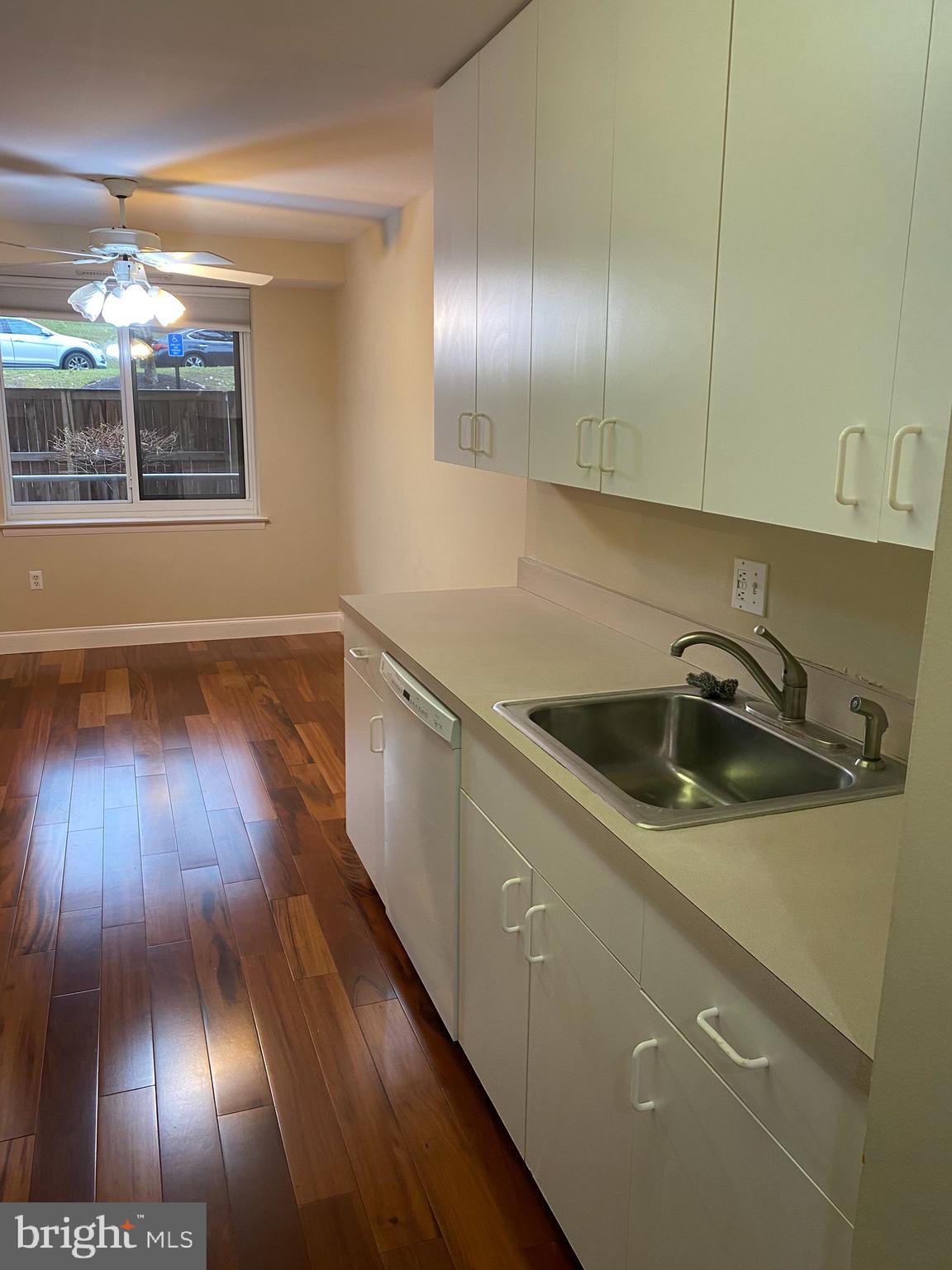 1637 Oakwood Drive, Unit S103 Narberth, PA 19072 - Photo 9 of 23 a kitchen with a sink and wooden floor