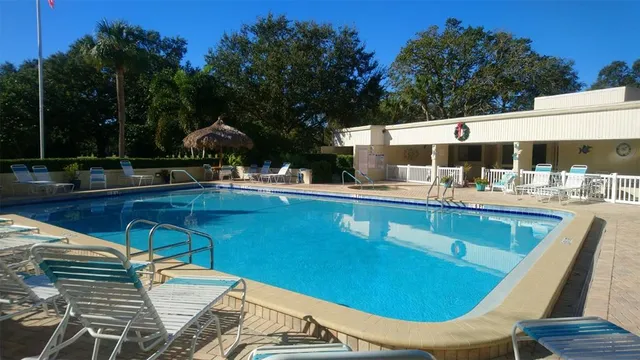 a view of a chairs and table in the patio