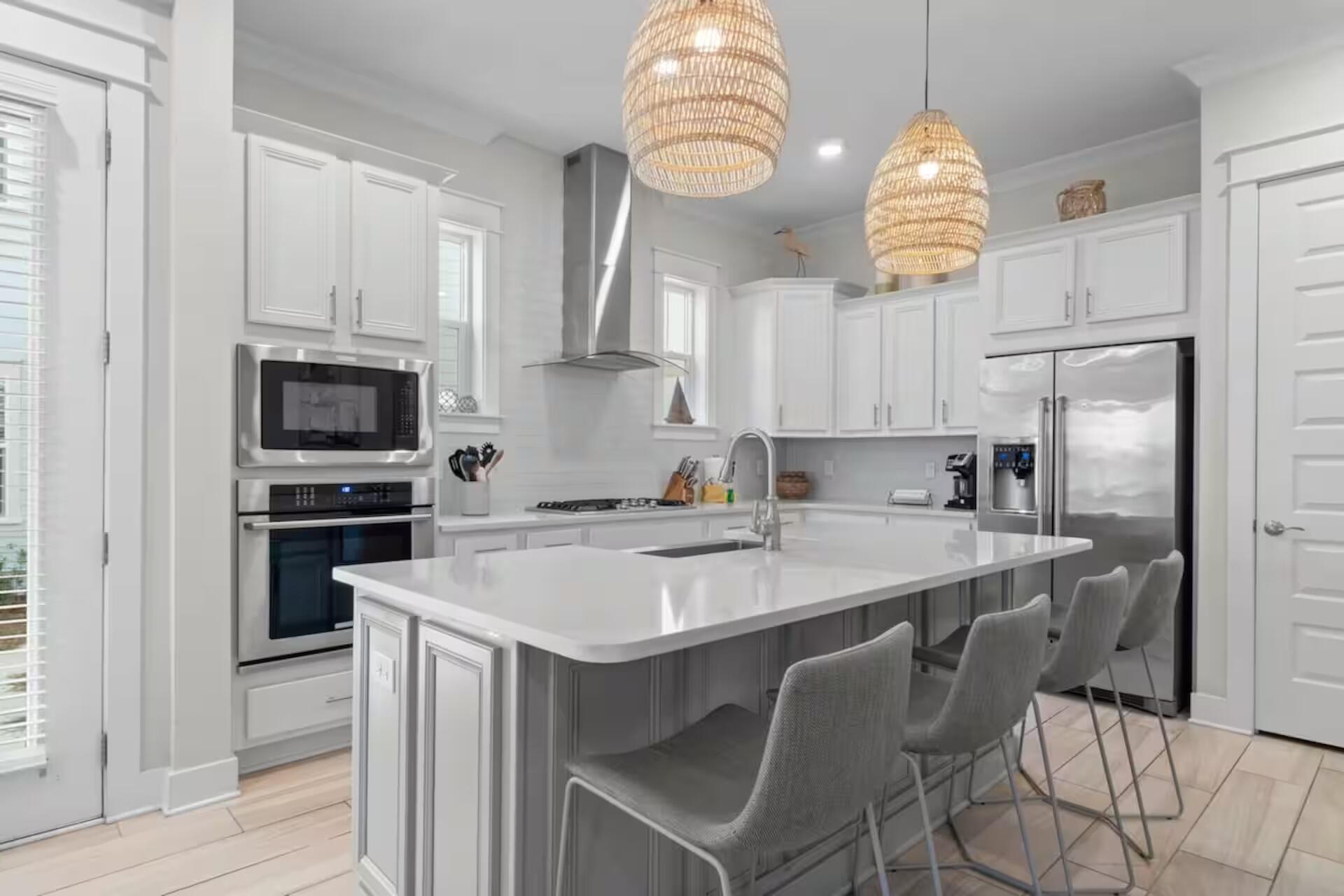 146 East E Pine, Unit B Inlet Beach, FL 32461 - Photo 6 of 47 a kitchen with a sink stainless steel appliances and white cabinets