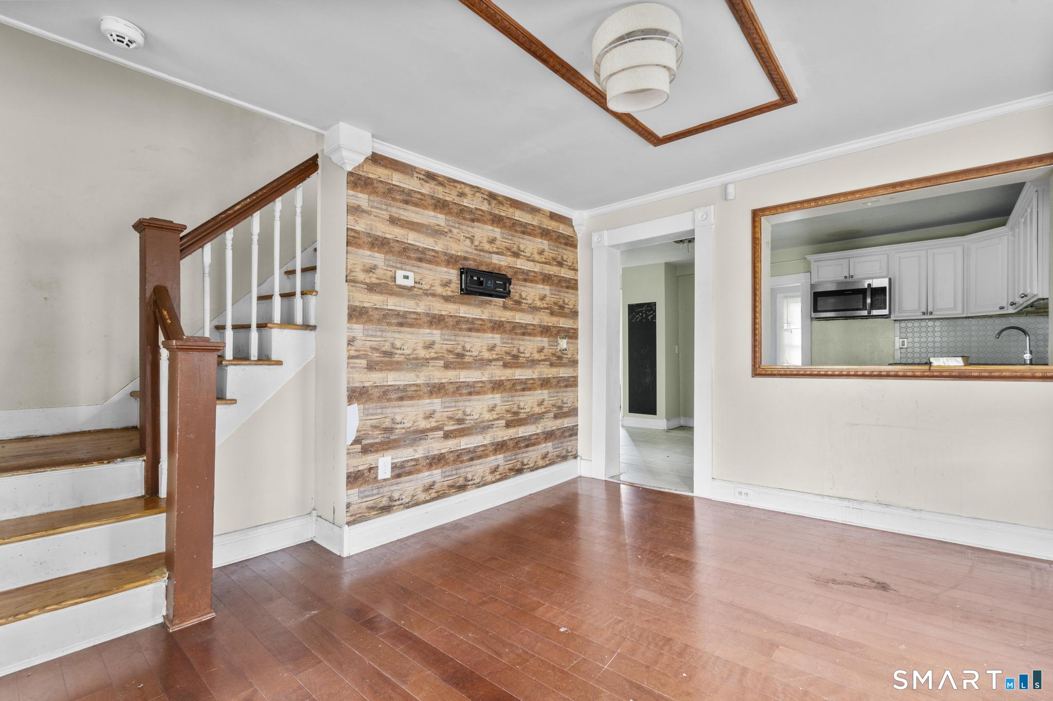 101 Meridian Street Meriden, CT 06451 - Photo 6 of 26 wooden floor in an empty room with a window