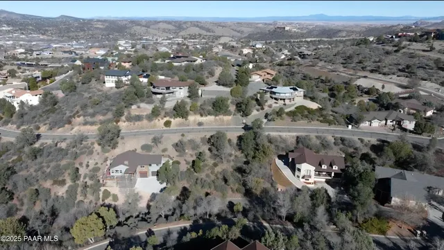 an aerial view of residential building and green space