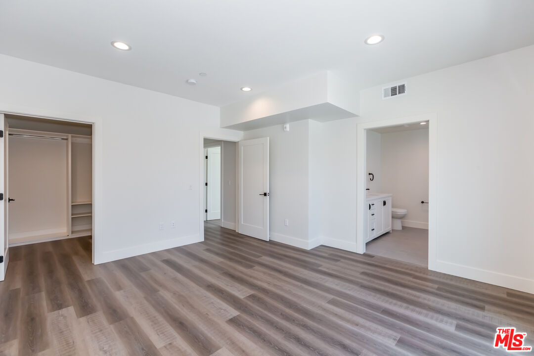 857 North Hayworth Avenue, Unit 403 Los Angeles, CA 90046 - Photo 27 of 52 a view of empty room with wooden floor