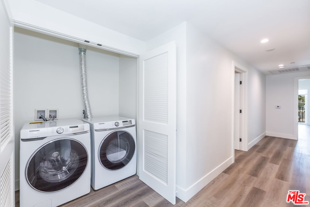 857 North Hayworth Avenue, Unit 403 Los Angeles, CA 90046 - Photo 42 of 52 a view of a storage & utility room with washer and dryer