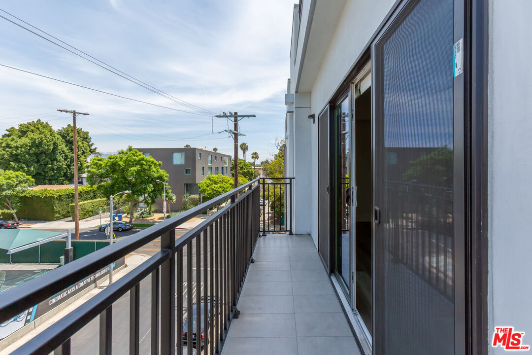 857 North Hayworth Avenue, Unit 403 Los Angeles, CA 90046 - Photo 43 of 52 a view of a balcony with potted plants