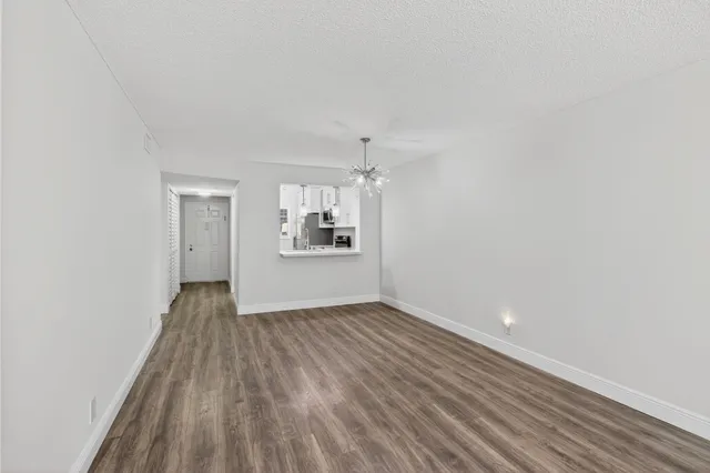 a view of kitchen and wooden floor