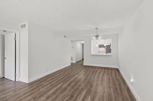 a kitchen with stainless steel appliances a refrigerator stove and microwave