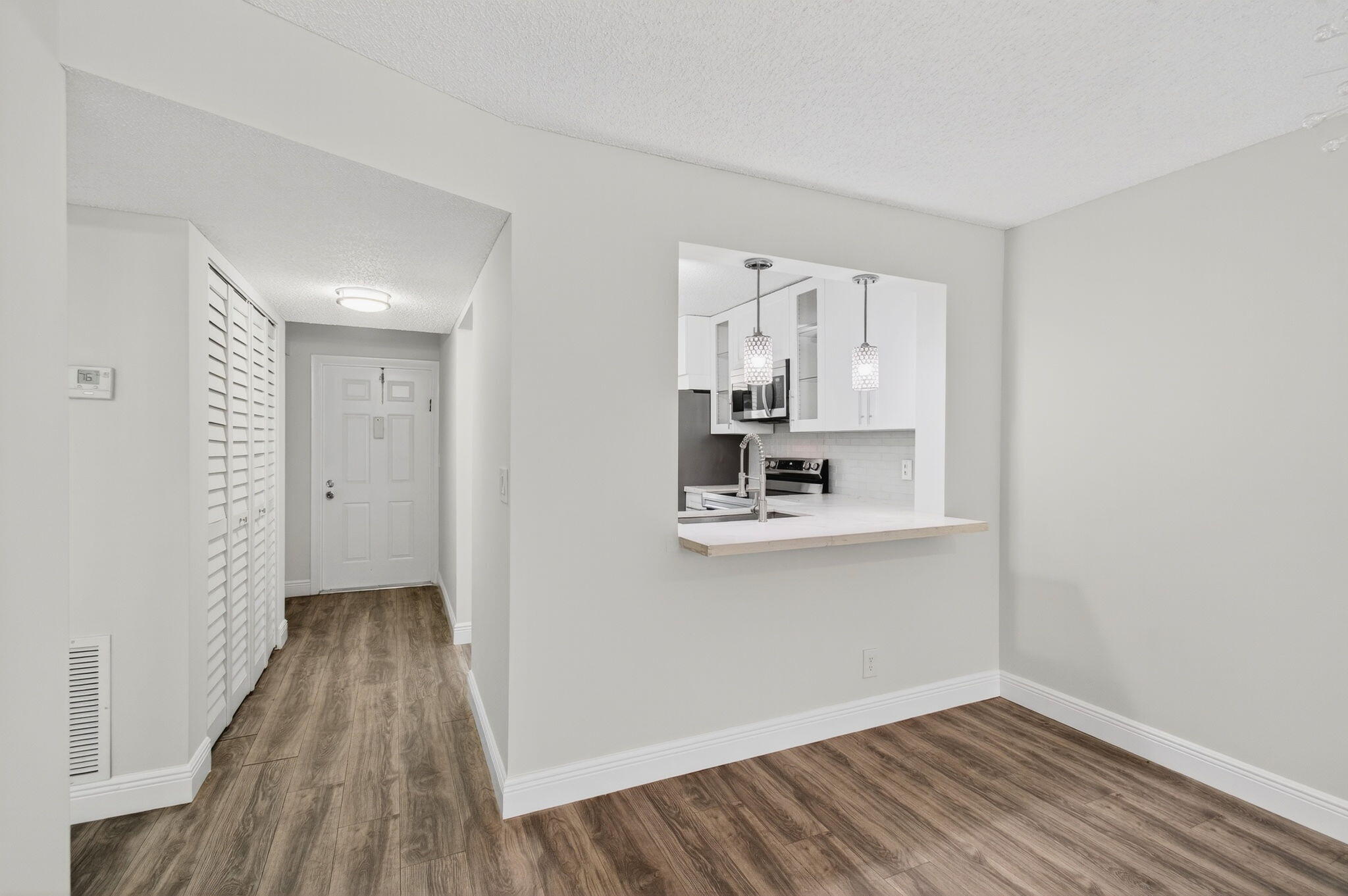 2975 Southwest 22nd Avenue, Unit 1070 Delray Beach, FL 33445 - Photo 20 of 60 a view of kitchen and wooden floor