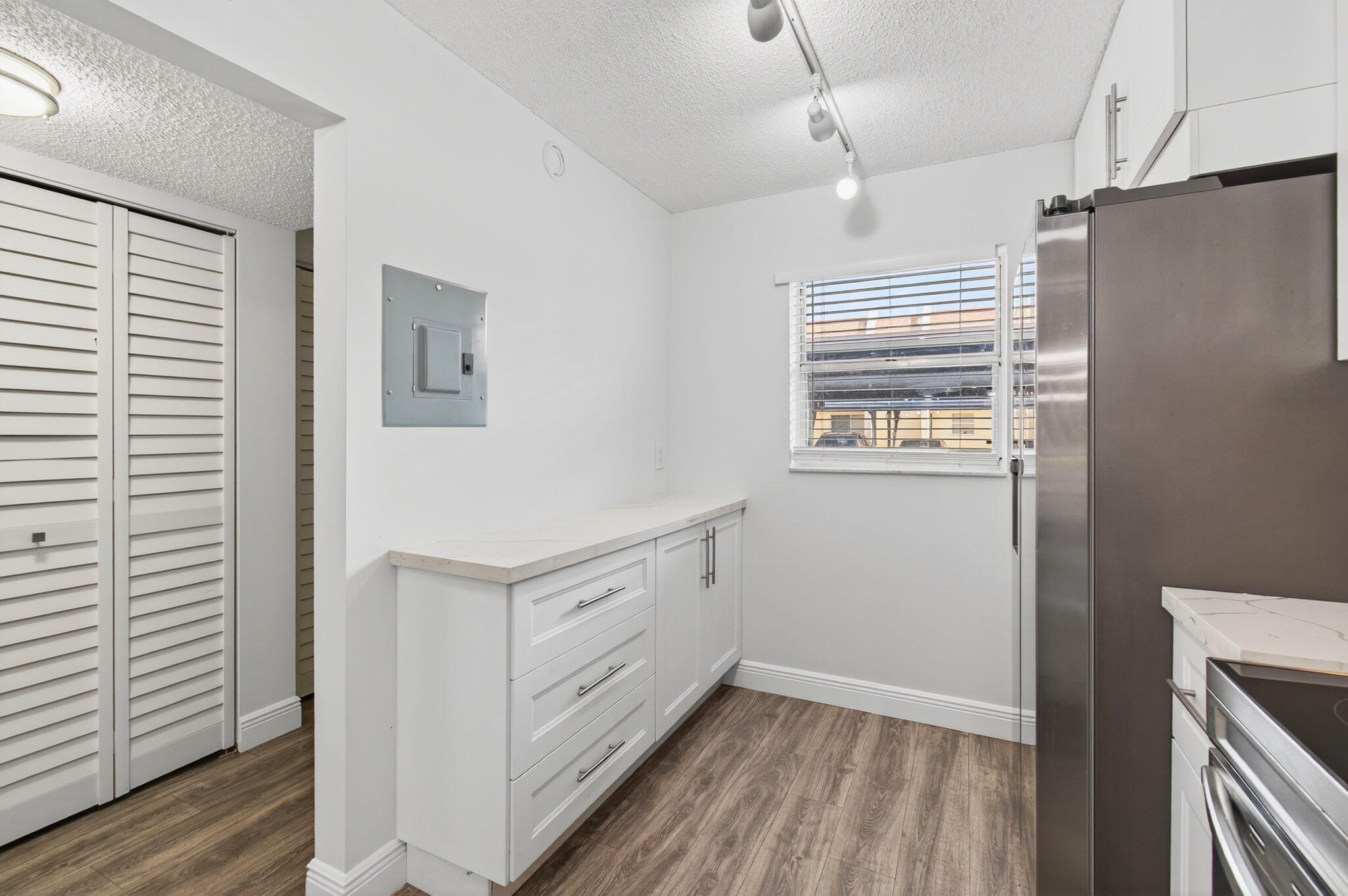 2975 Southwest 22nd Avenue, Unit 1070 Delray Beach, FL 33445 - Photo 23 of 60 a kitchen with stainless steel appliances a refrigerator and a window