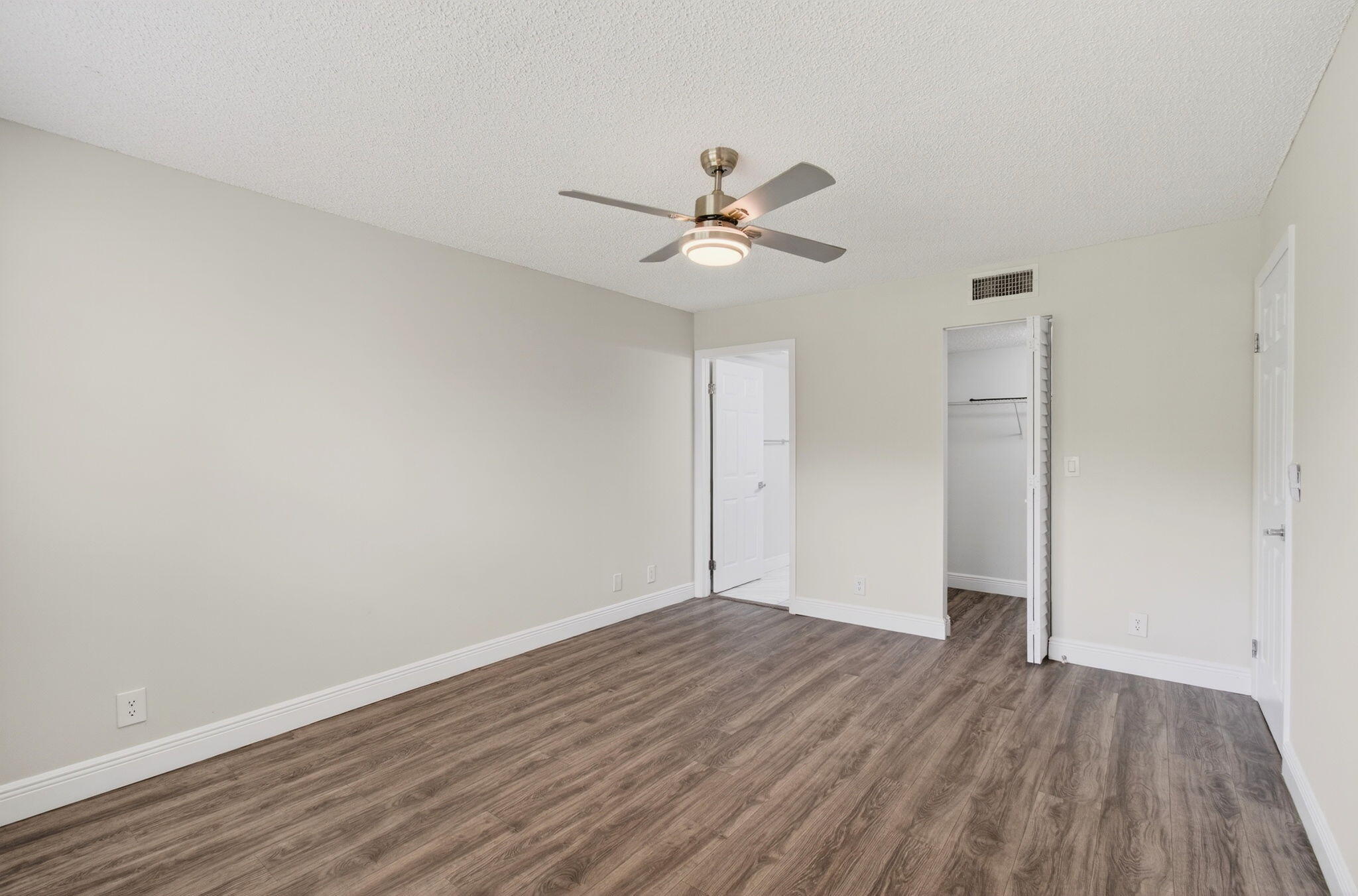2975 Southwest 22nd Avenue, Unit 1070 Delray Beach, FL 33445 - Photo 30 of 60 a view of empty room with wooden floor