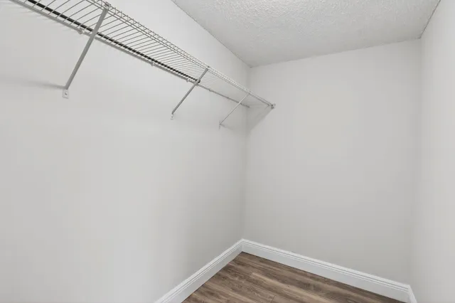 a bathroom with a sink a toilet and window