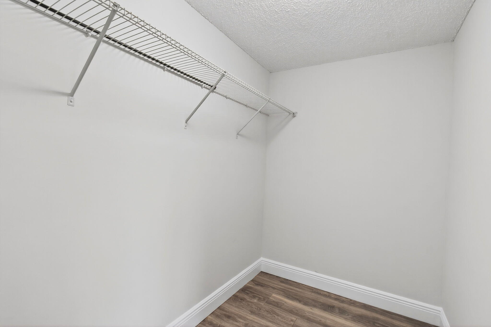 2975 Southwest 22nd Avenue, Unit 1070 Delray Beach, FL 33445 - Photo 32 of 60 a view of a room with racks on the wall
