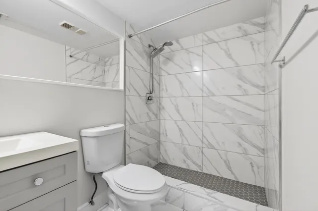 a picture of a bathroom with a sink and mirror