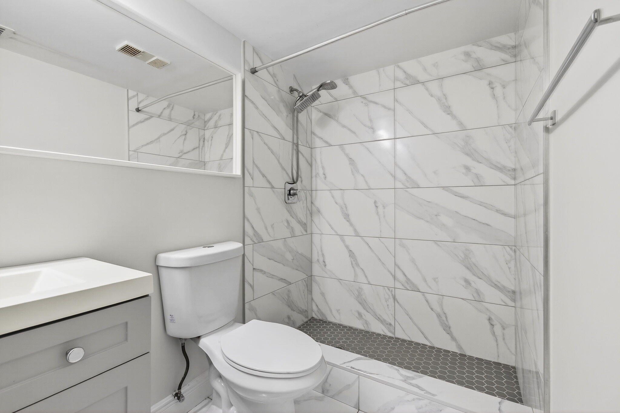 2975 Southwest 22nd Avenue, Unit 1070 Delray Beach, FL 33445 - Photo 42 of 60 a white toilet sitting next to a bathroom sink