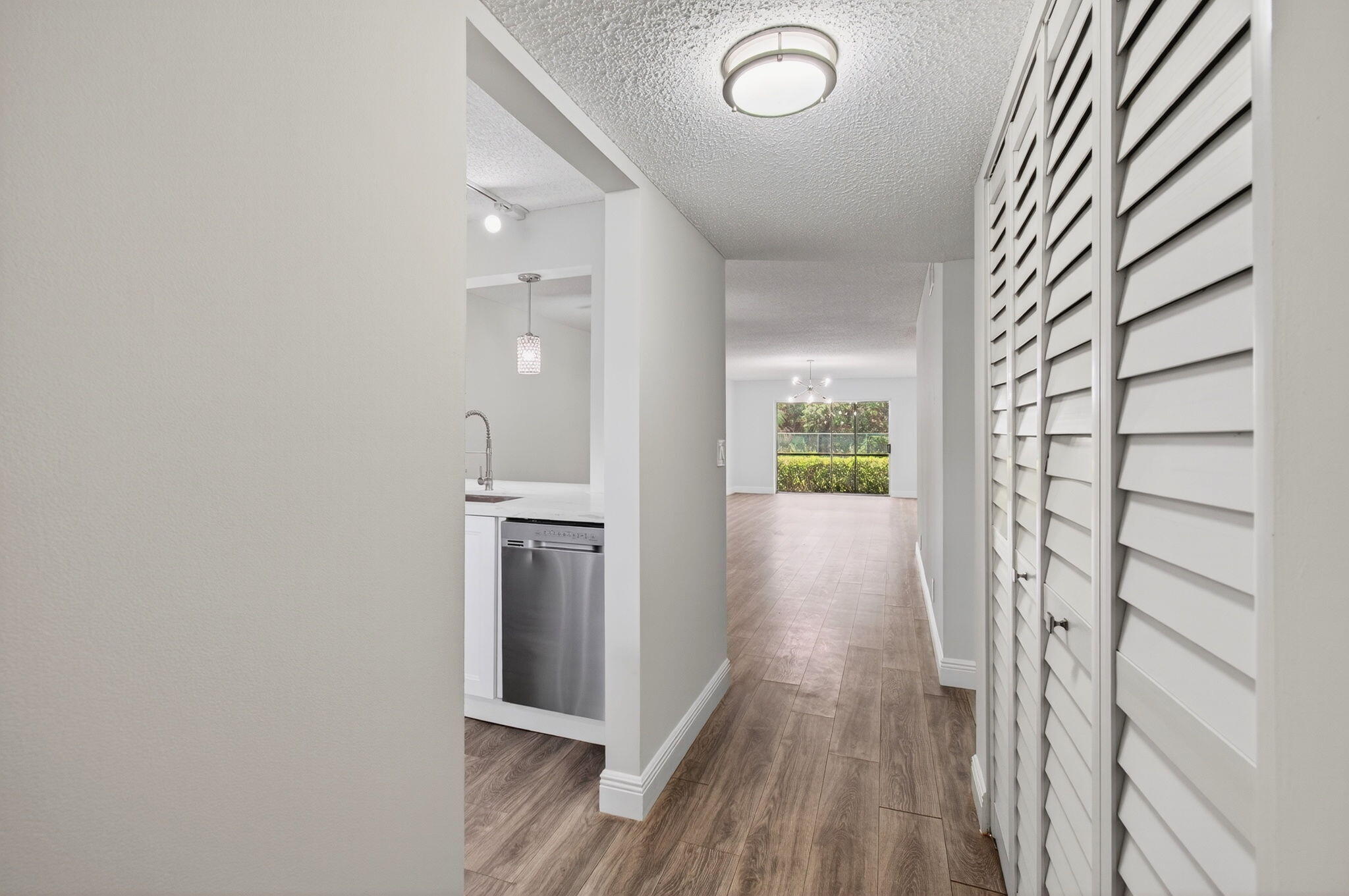 2975 Southwest 22nd Avenue, Unit 1070 Delray Beach, FL 33445 - Photo 7 of 60 a view of hallway with wooden floor