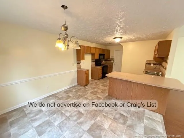 a spacious bathroom with a tub sink and a mirror