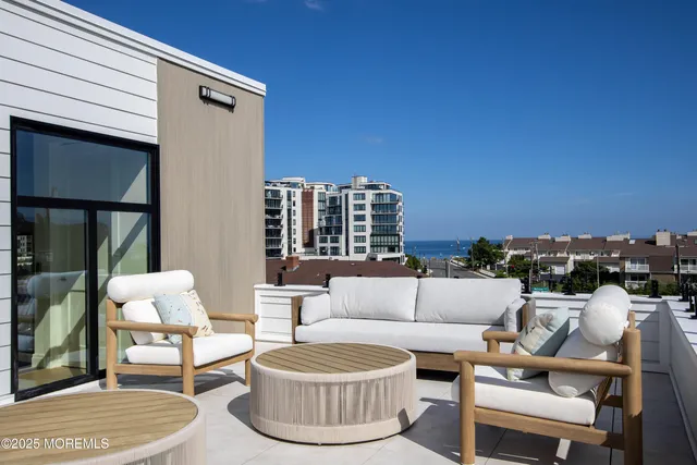 a building outdoor space with patio furniture and a potted plant