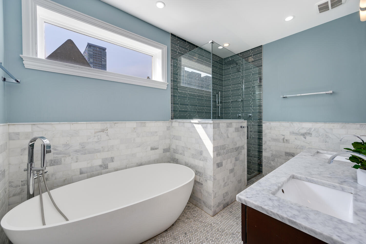 113 West Elm Street Chicago, IL 60610 - Photo 13 of 30 a bathroom with a tub a sink and wooden floor