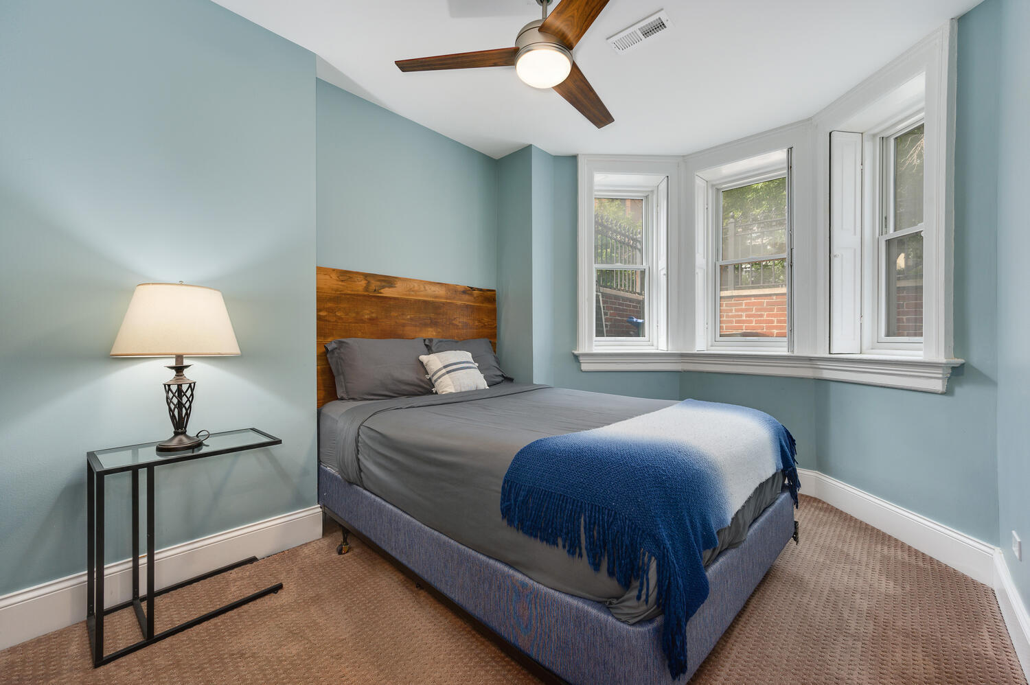 113 West Elm Street Chicago, IL 60610 - Photo 18 of 30 a bedroom with a bed lamp and a window