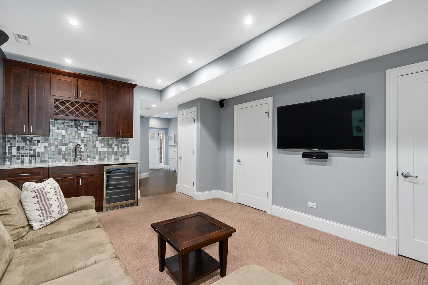 113 West Elm Street Chicago, IL 60610 - Photo 23 of 30 a living room with furniture and a flat screen tv