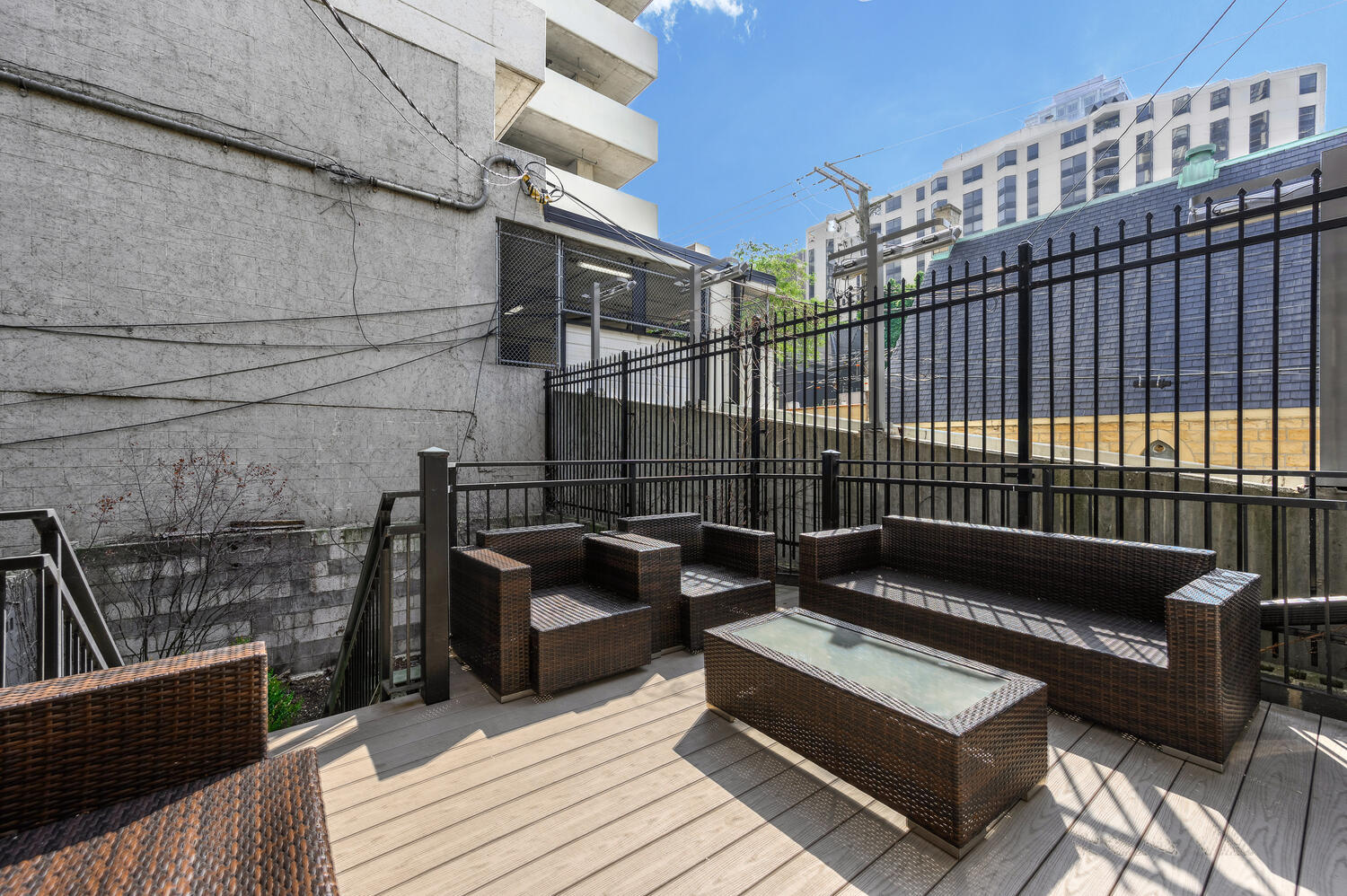 113 West Elm Street Chicago, IL 60610 - Photo 25 of 30 a view of roof deck with couches and wooden floor