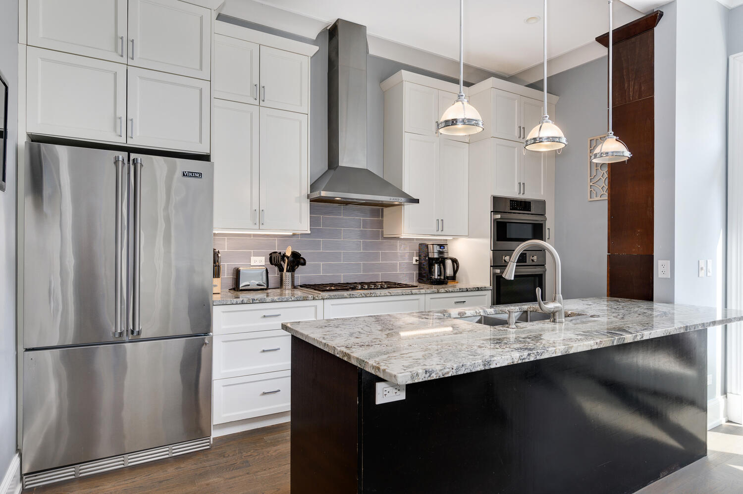 113 West Elm Street Chicago, IL 60610 - Photo 5 of 30 a kitchen with kitchen island a counter space appliances and cabinets