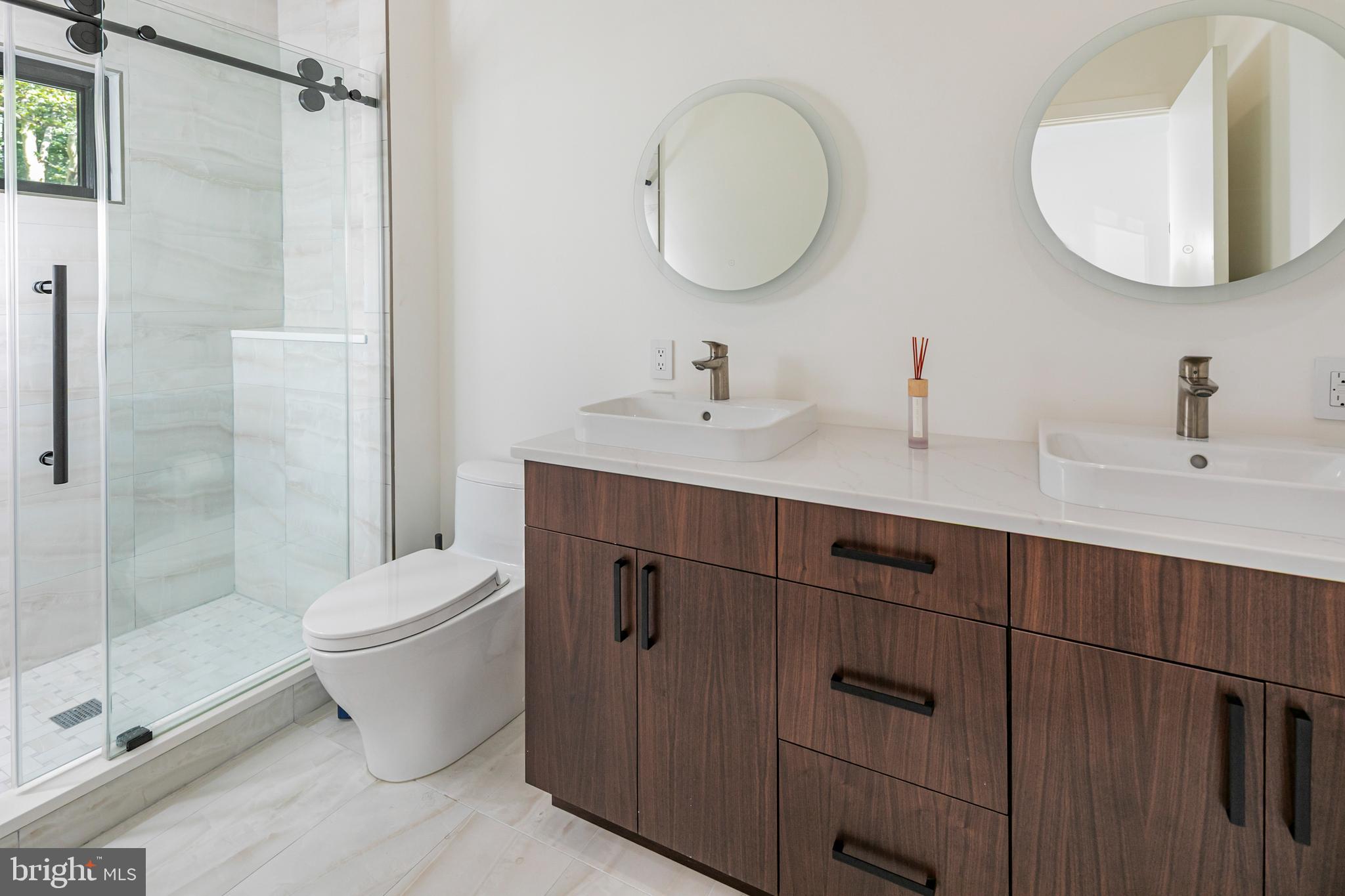 44 Armour Road Princeton, NJ 08540 - Photo 16 of 51 a bathroom with a toilet a sink and mirror