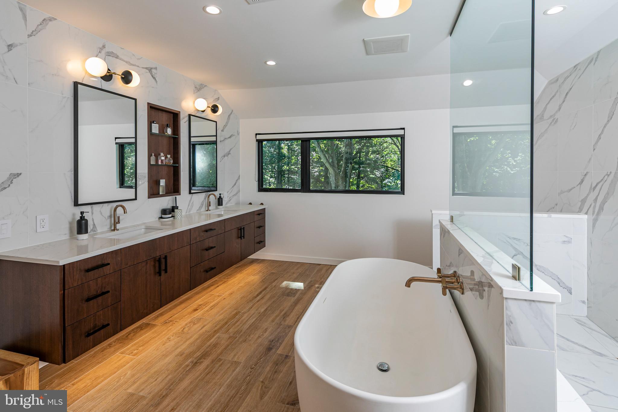 44 Armour Road Princeton, NJ 08540 - Photo 25 of 51 a bathroom with a double vanity sink mirror and bathtub