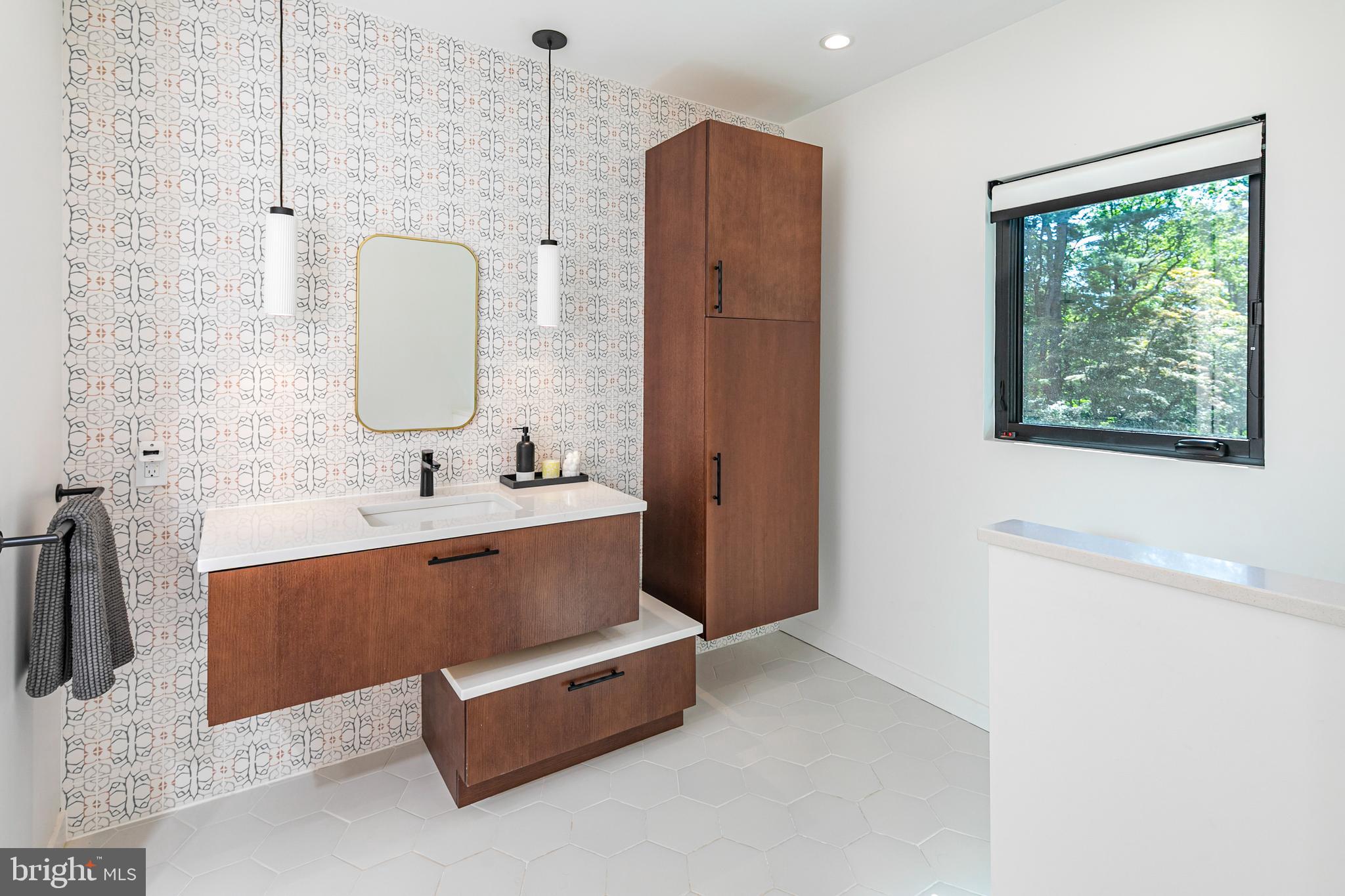44 Armour Road Princeton, NJ 08540 - Photo 29 of 51 a bathroom with a tub sink and mirror