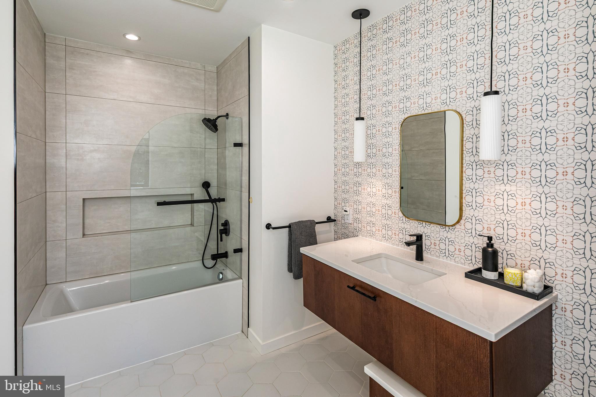 44 Armour Road Princeton, NJ 08540 - Photo 30 of 51 a bathroom with a sink tub vanity and shower