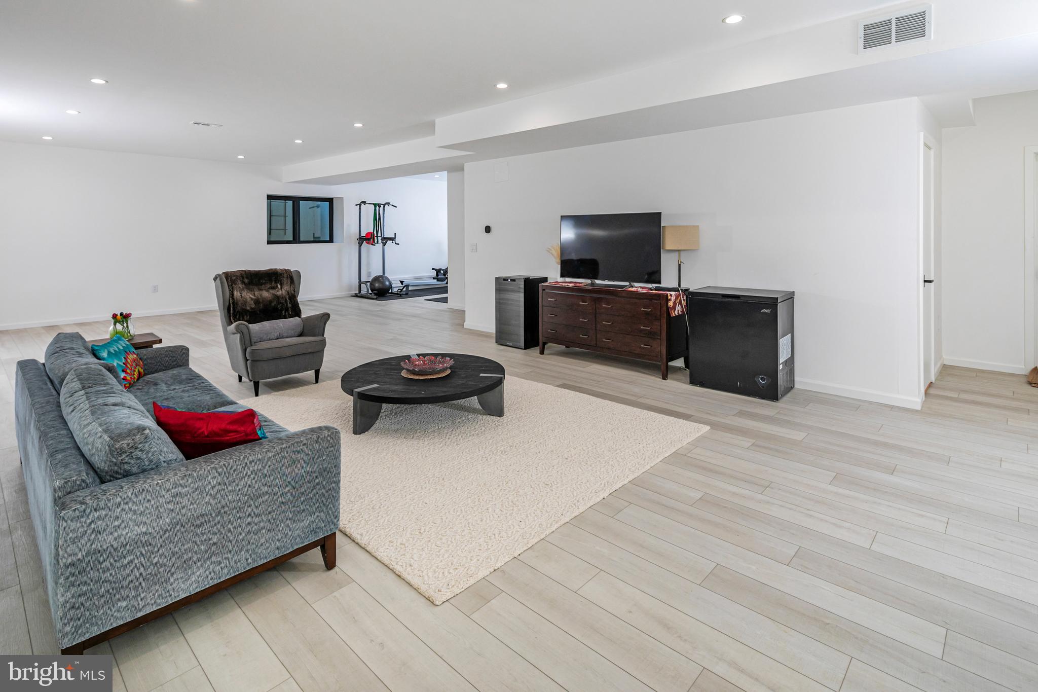 44 Armour Road Princeton, NJ 08540 - Photo 37 of 51 a living room with furniture and a flat screen tv