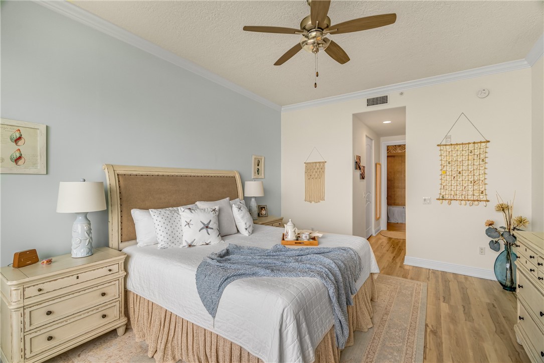 1701 Gulfstream Avenue, Unit 729 Fort Pierce, FL 34949 - Photo 20 of 36 a bedroom with a bed and a chandelier