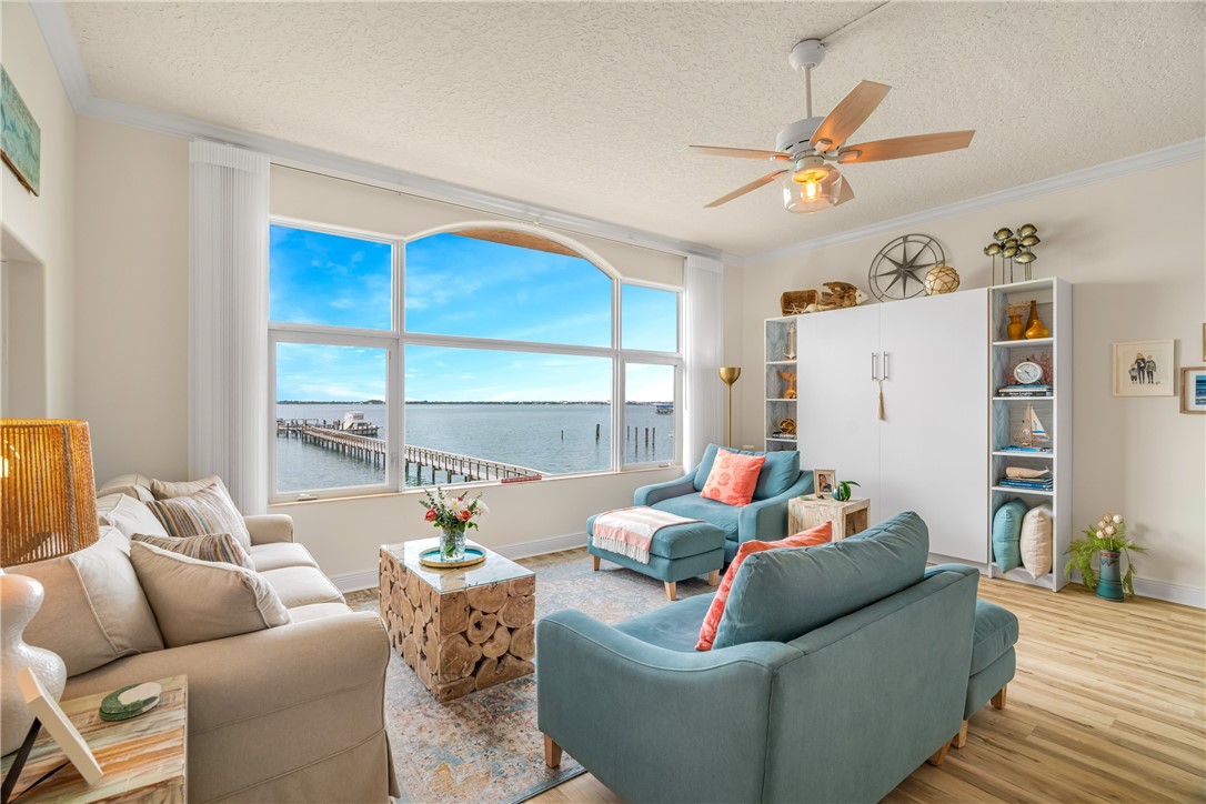 1701 Gulfstream Avenue, Unit 729 Fort Pierce, FL 34949 - Photo 4 of 36 a living room with furniture and a large window