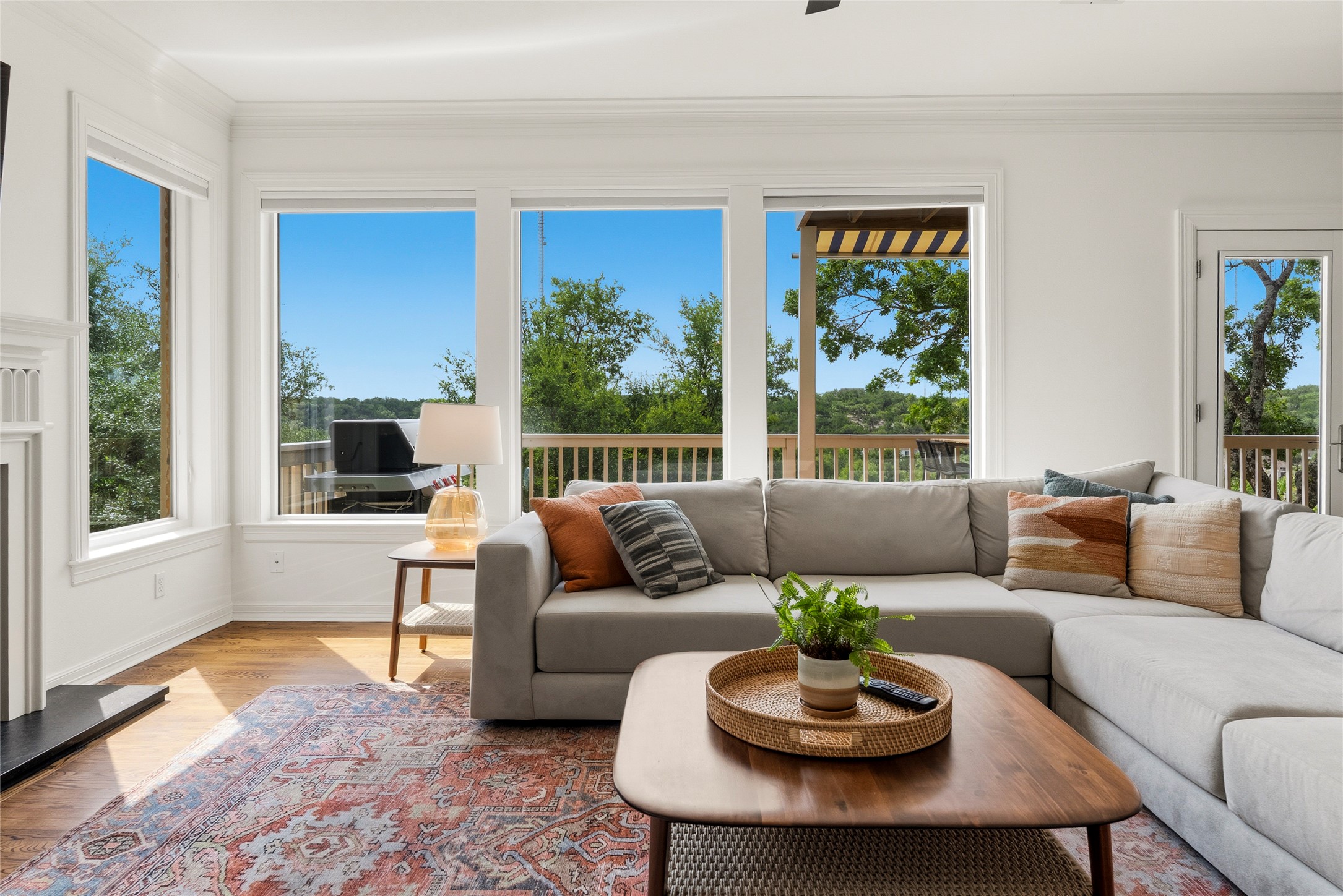 3107 Lookout Lane Austin, TX 78746 - Photo 4 of 39 A sun-filled living space offers seamless indoor-outdoor living with panoramic natural views.